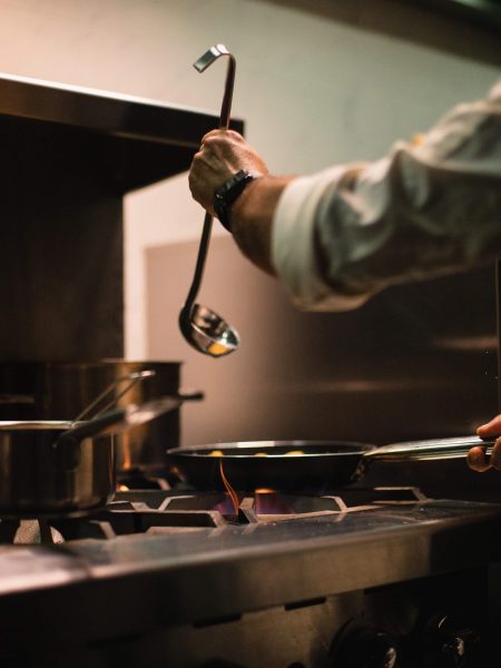 Image of someone using a ladle to pour into a pan