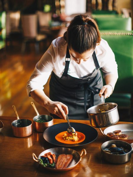 Image of a chef plating food